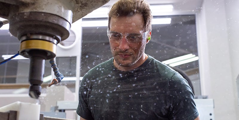 Nottingham Spirk prototyper operating a CNC machine.