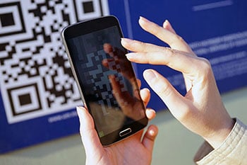 Consumer scanning a QR Code